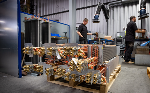 Bottom shot of fan coil units on factory floor